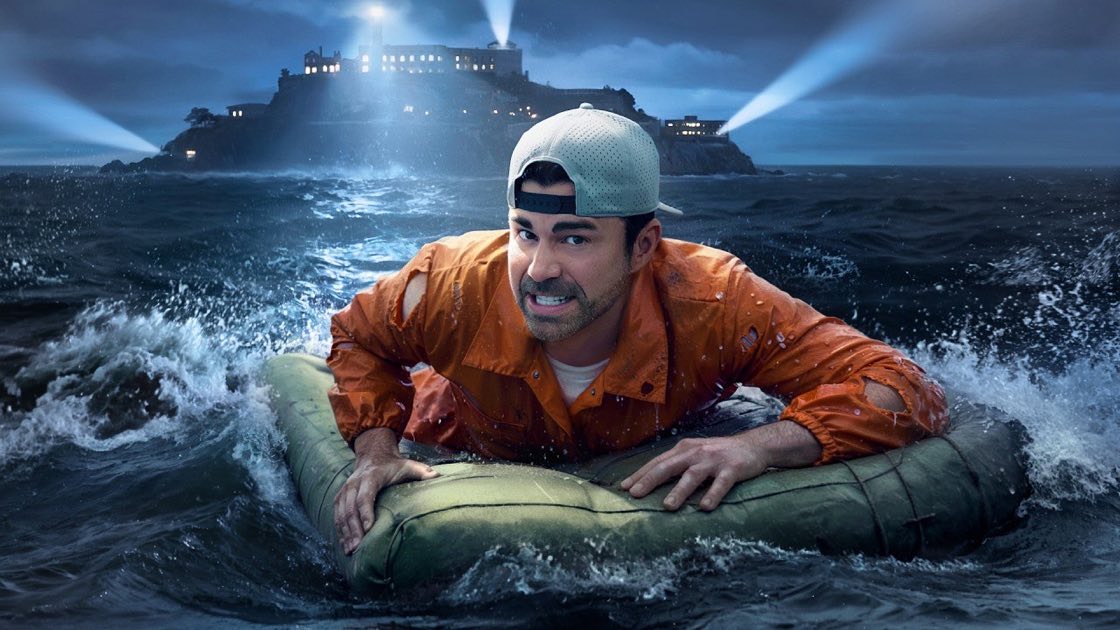 Mark Rober's "How to Escape Alcatraz With Basic Engineering" thumbnail, Rober in an orange jacket on a raft with the lit Alcatraz prison and cold blue water behind him