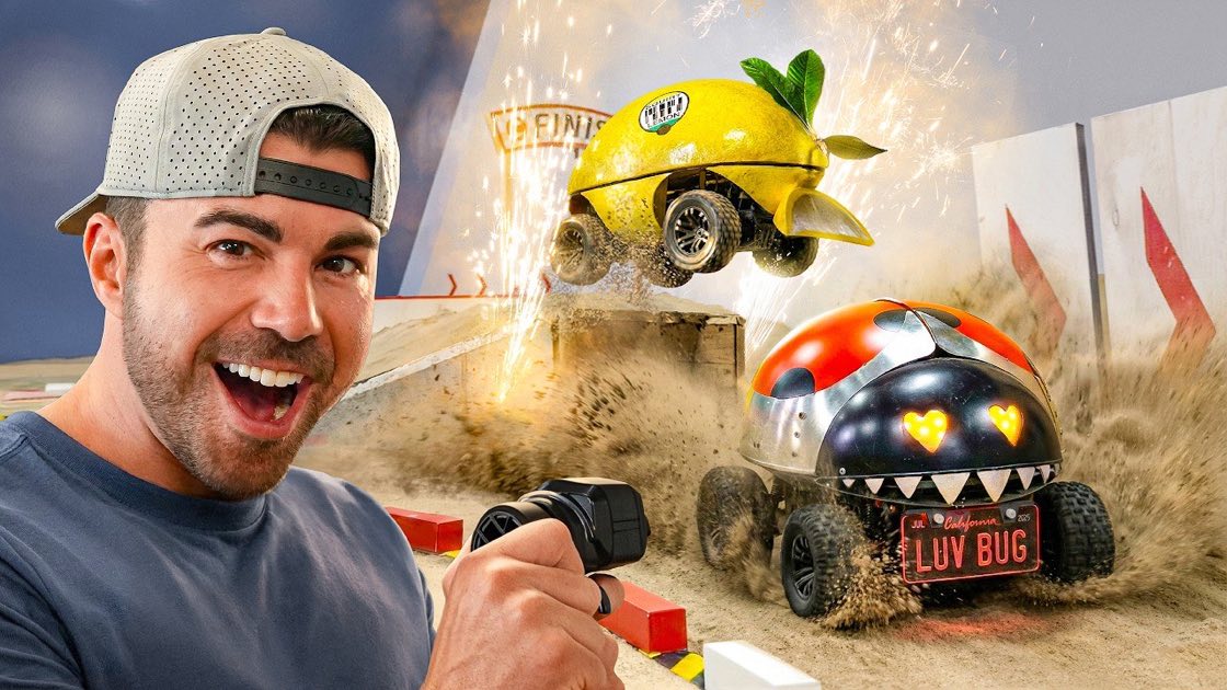 Mark Rober's "Engineers vs Junkyard RC Car Death Match" thumbnail, Rober laughing as two combat RC cars collide mid-air